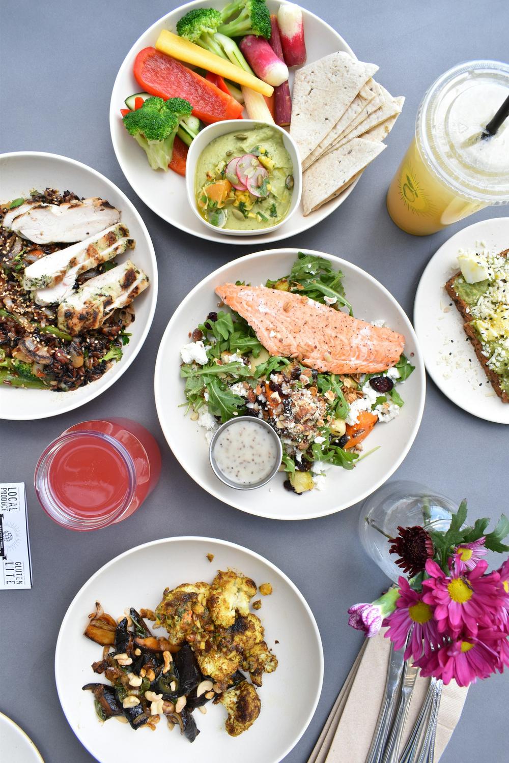 A table spread with plates of food